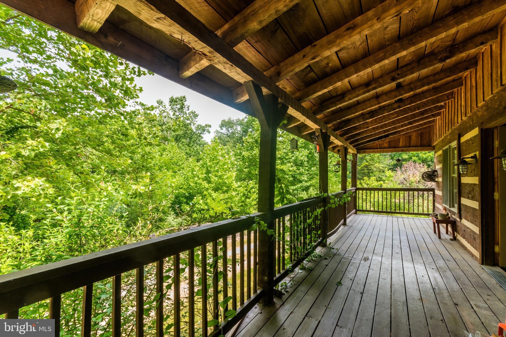 covered front porch runs entire length of home
