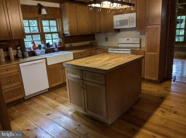 butcher block on the island and the thick plank