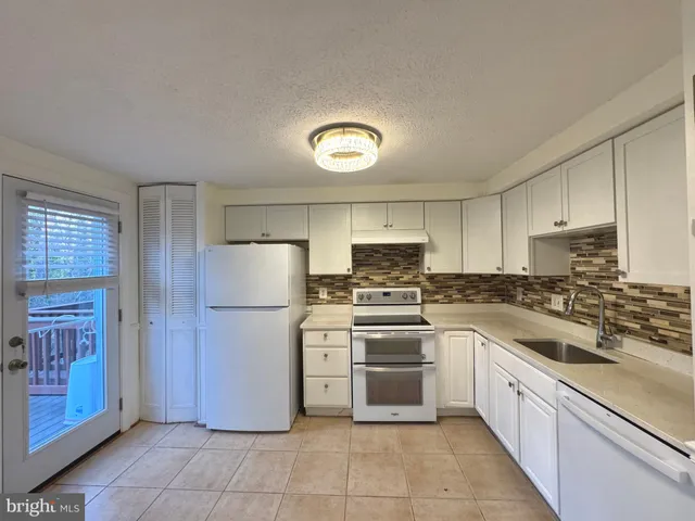 a view of a wooden deck with furniture