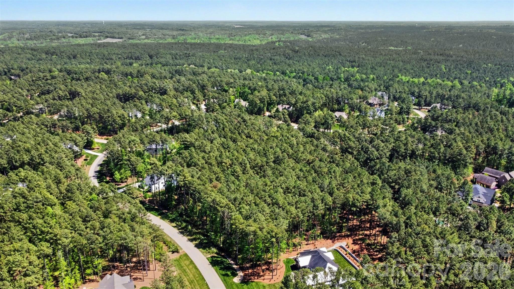 4337 Persimmon Road Lancaster, SC 29720 - Photo 2 of 14 a view of a city with lush green forest