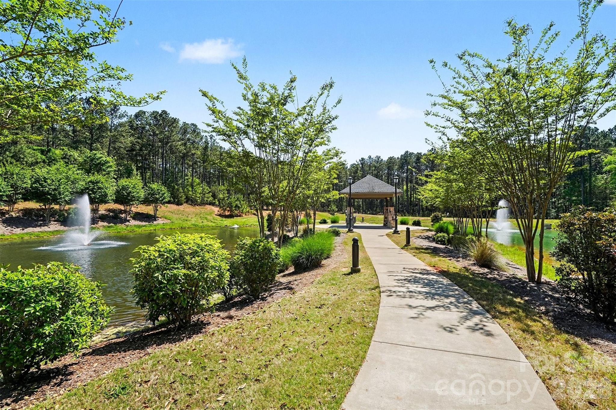 4337 Persimmon Road Lancaster, SC 29720 - Photo 9 of 14 a view of a garden with a fountain