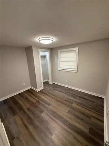 a view of a kitchen with a sink and cabinets