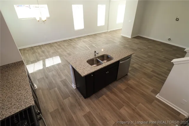 a room with wooden floor and window