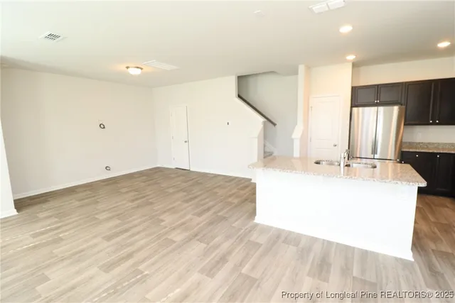 a large white room with a large bed