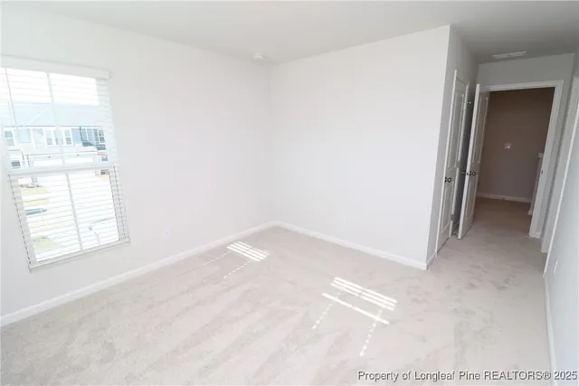 a view of empty room with a window