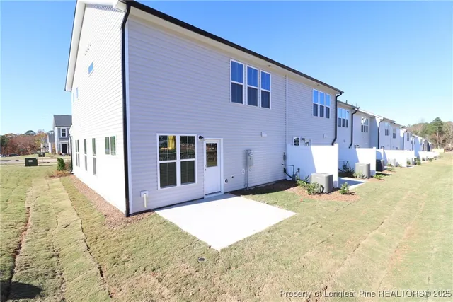 a view of a house with snow on the road