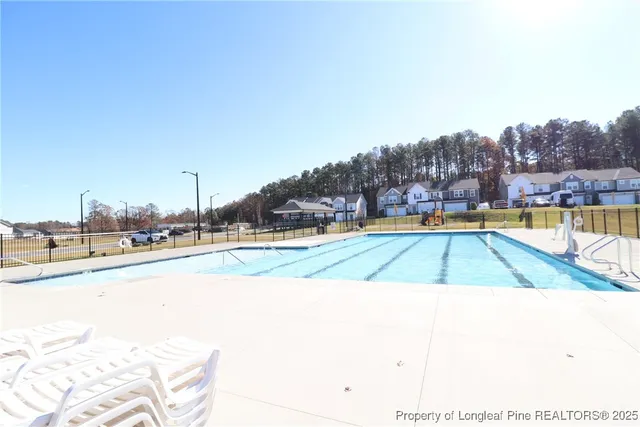 a view of a swimming pool and an outdoor space