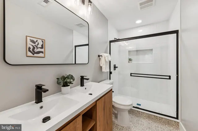 a bathroom with a sink toilet and vanity