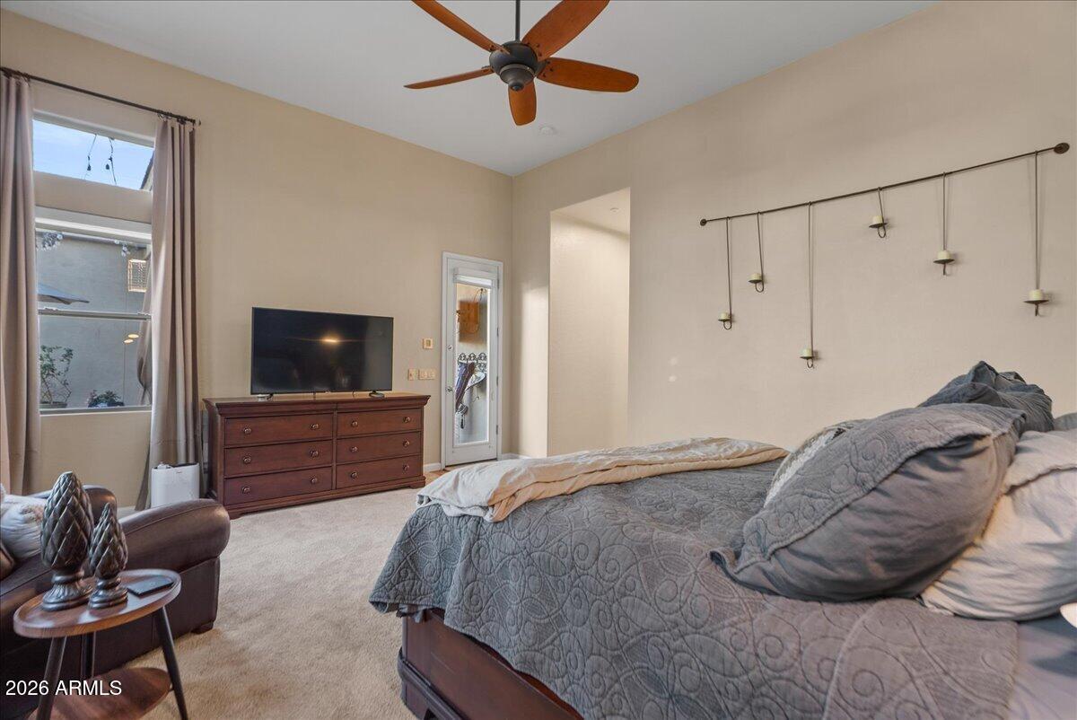 6427 South Magic Court Gilbert, AZ 85298 - Photo 29 of 71 a bedroom with a bed and a television