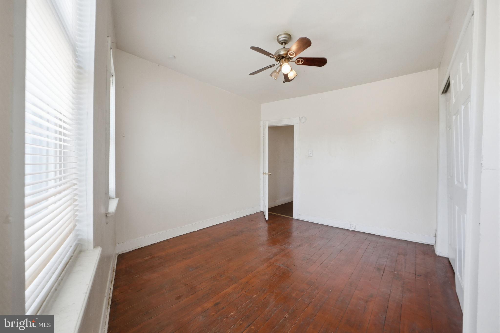 3449 Old Frederick Road Baltimore, MD 21229 - Photo 12 of 25 Bright, airy room with wooden floors.
