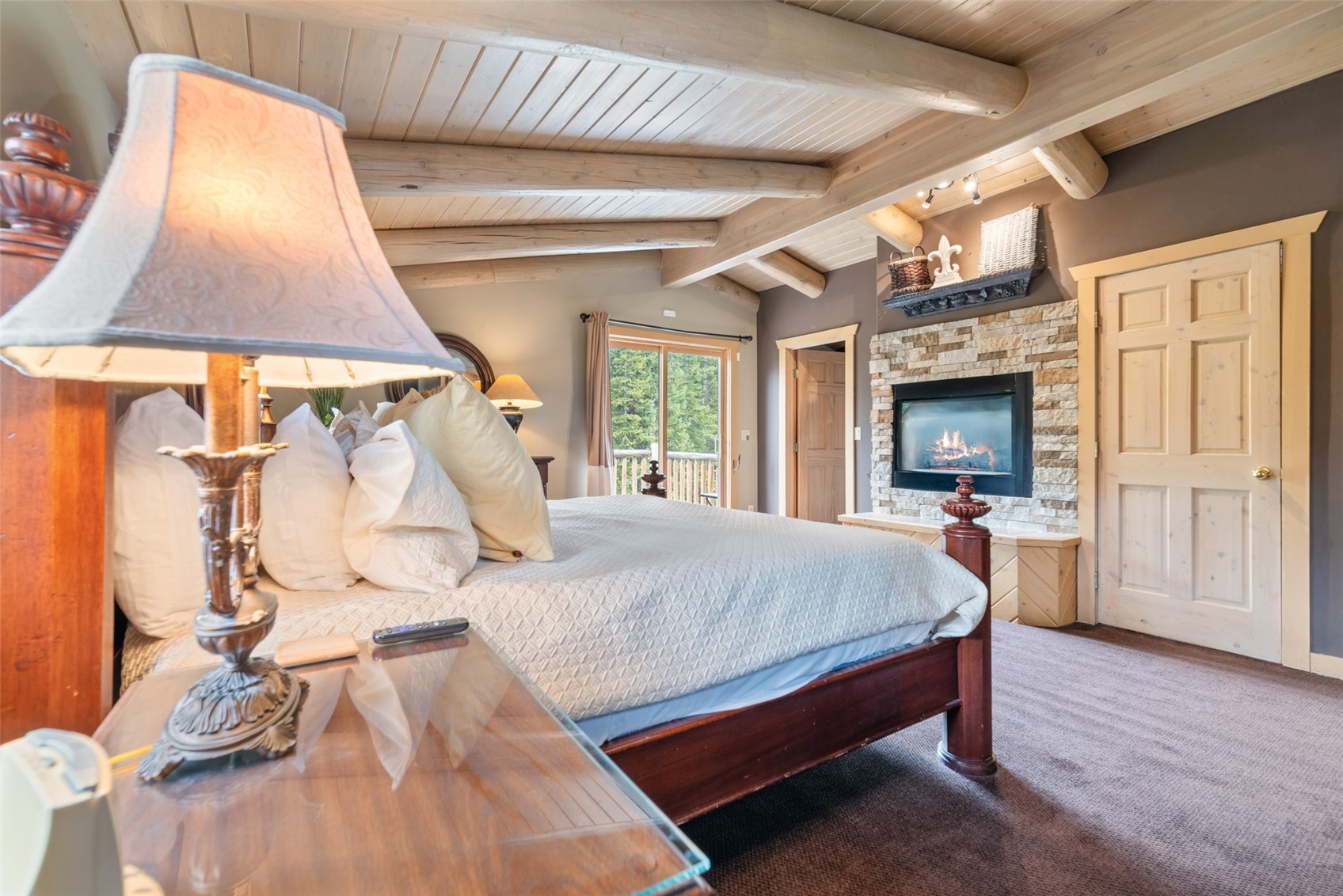 243 Rena Road Breckenridge, CO 80424 - Photo 10 of 50 Carpeted bedroom featuring vaulted ceiling with beams and a fireplace