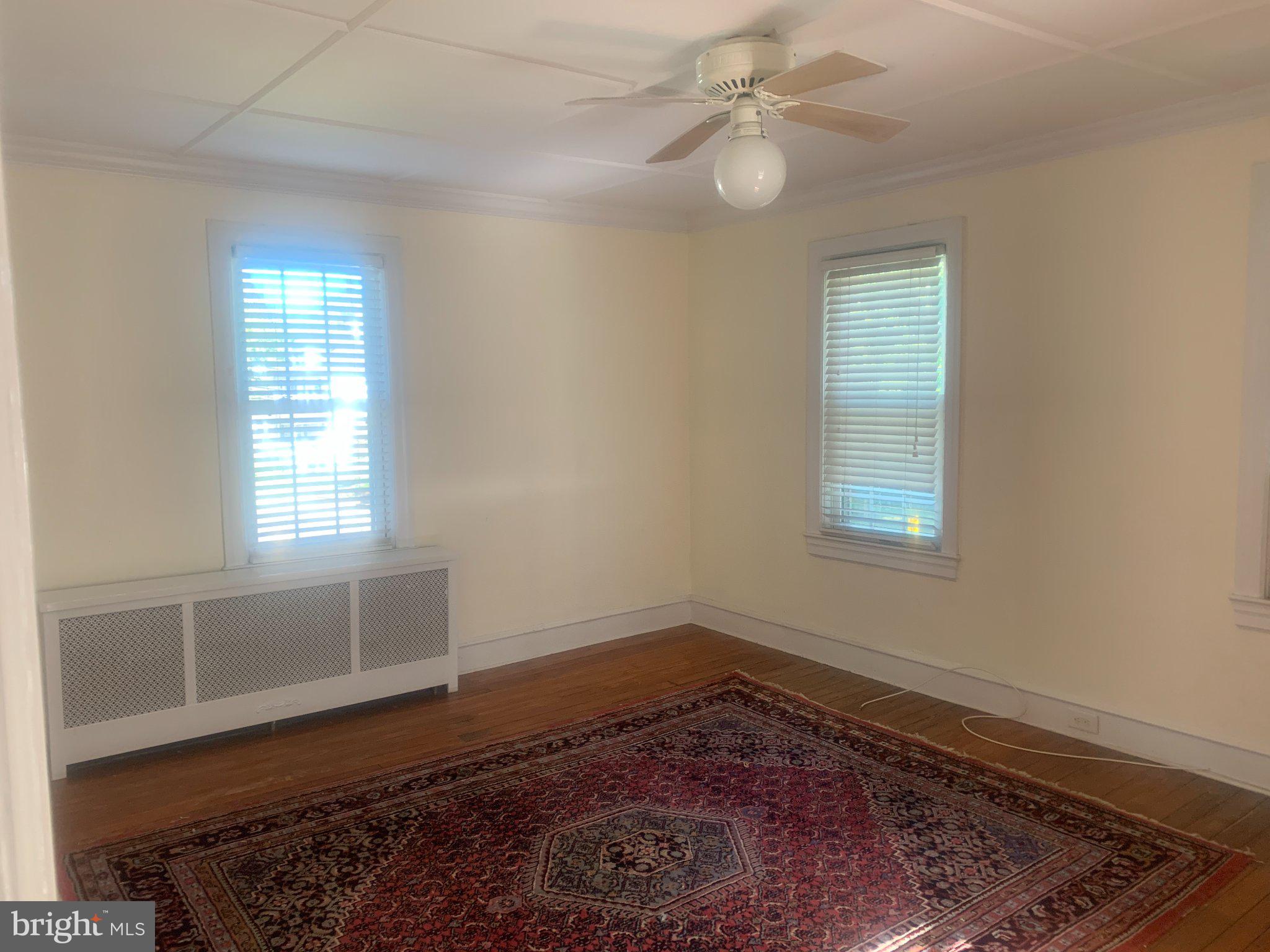 915 Stone Road, Unit A Laurel Springs, NJ 08021 - Photo 12 of 13 a view of a room with wooden floor and window