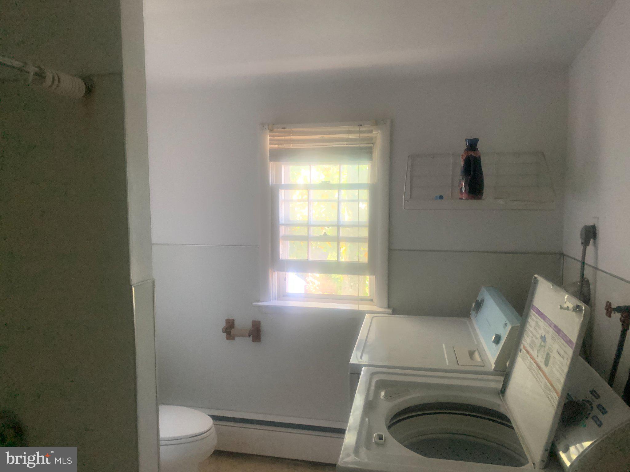 915 Stone Road, Unit A Laurel Springs, NJ 08021 - Photo 7 of 13 a bathroom with a toilet and a sink