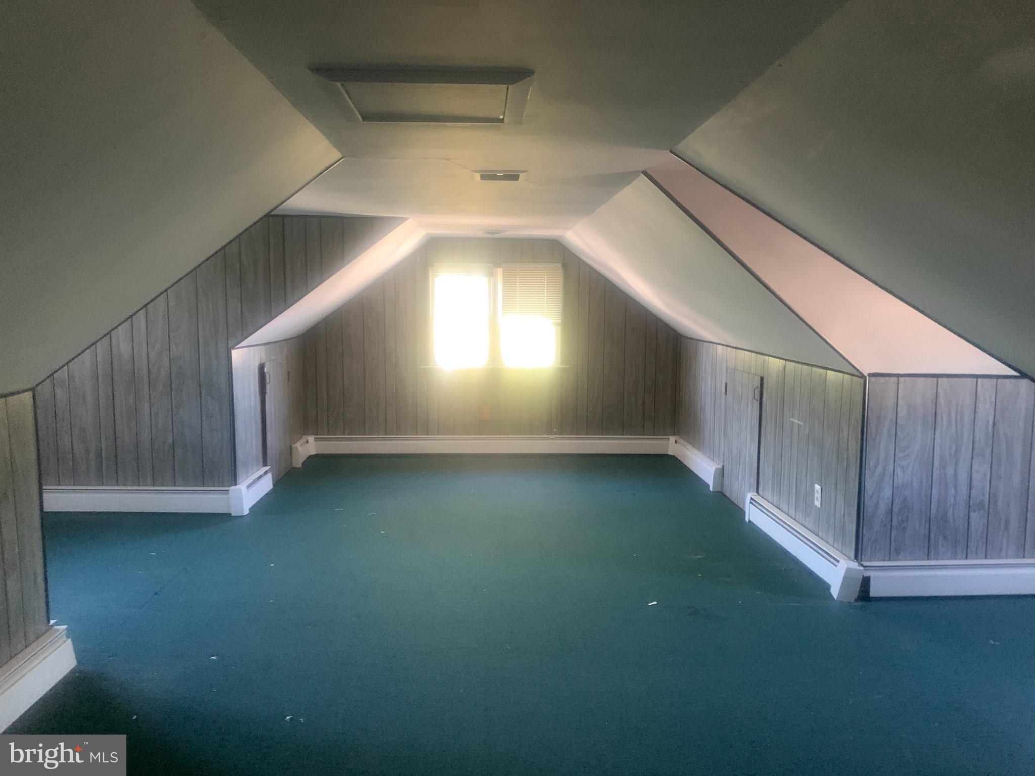 915 Stone Road, Unit A Laurel Springs, NJ 08021 - Photo 8 of 13 a view of an empty room with wooden floor and a window
