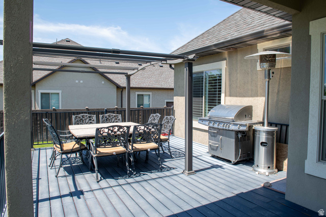 646 East 1400th Street North Mapleton, UT 84664 - Photo 71 of 78 Spacious outdoor deck featuring gray wood-finish flooring, a covered pergola structure, and stucco exterior siding
