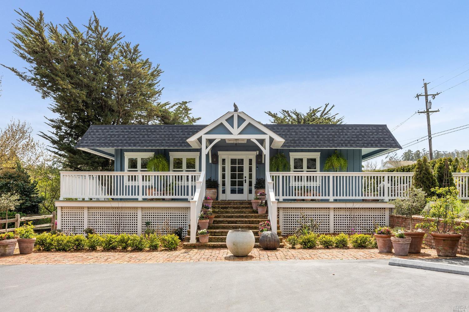 front view of a house with a garden