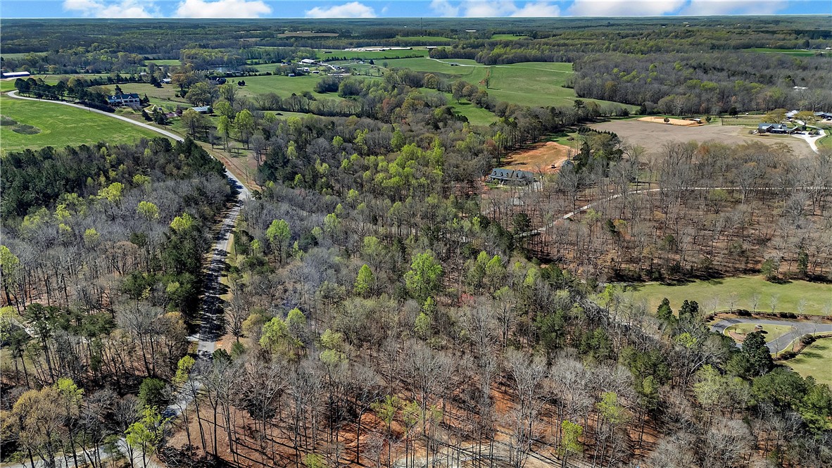 3.271 Coneross Point Drive Seneca, SC 29678 - Photo 5 of 9 Expansive acreage provides a picturesque backdrop, perfect for tranquil living amidst nature.