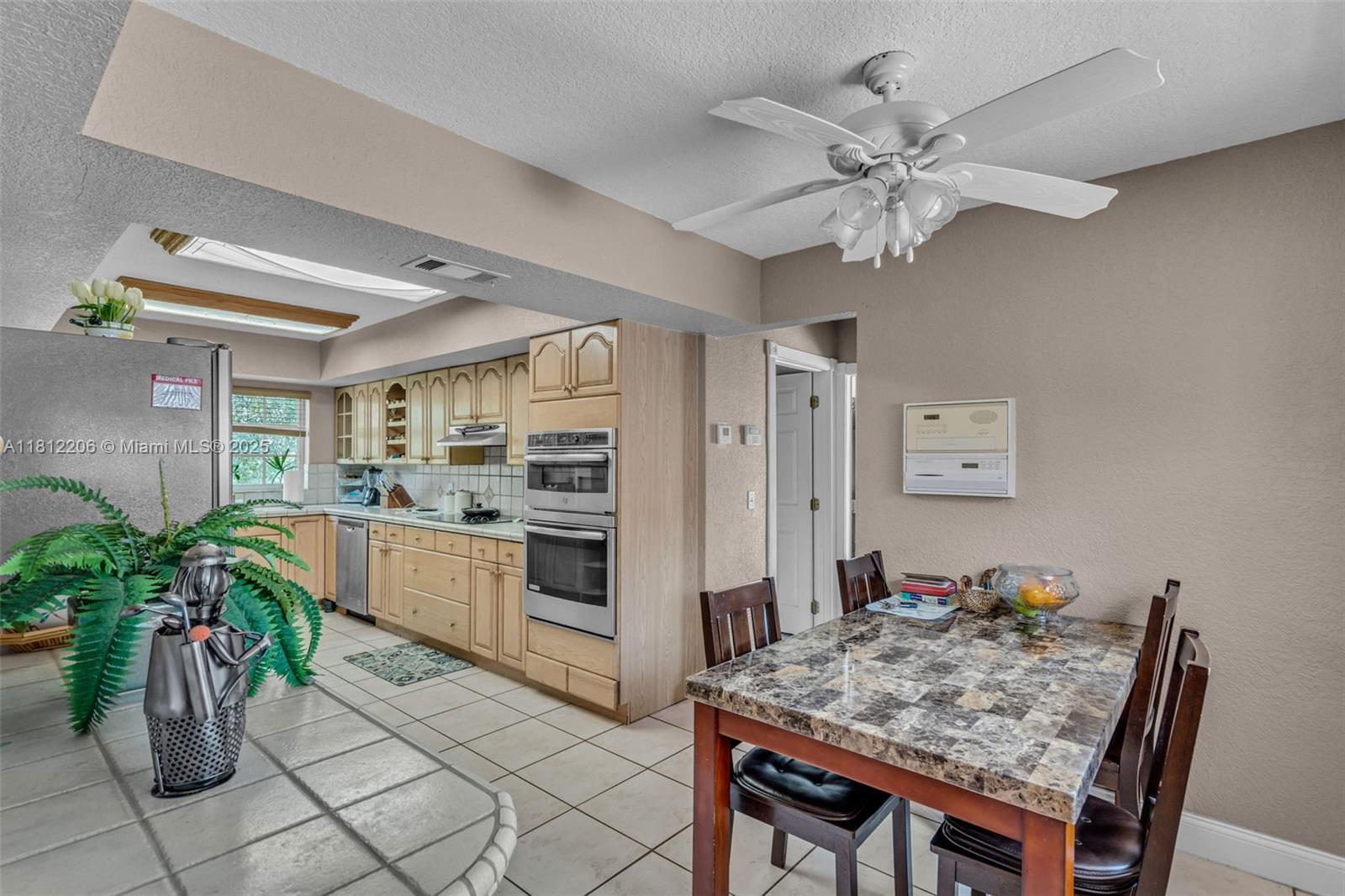 17550 Southwest 59th Court Southwest Ranches, FL 33331 - Photo 14 of 51 a kitchen with a table and chairs in it