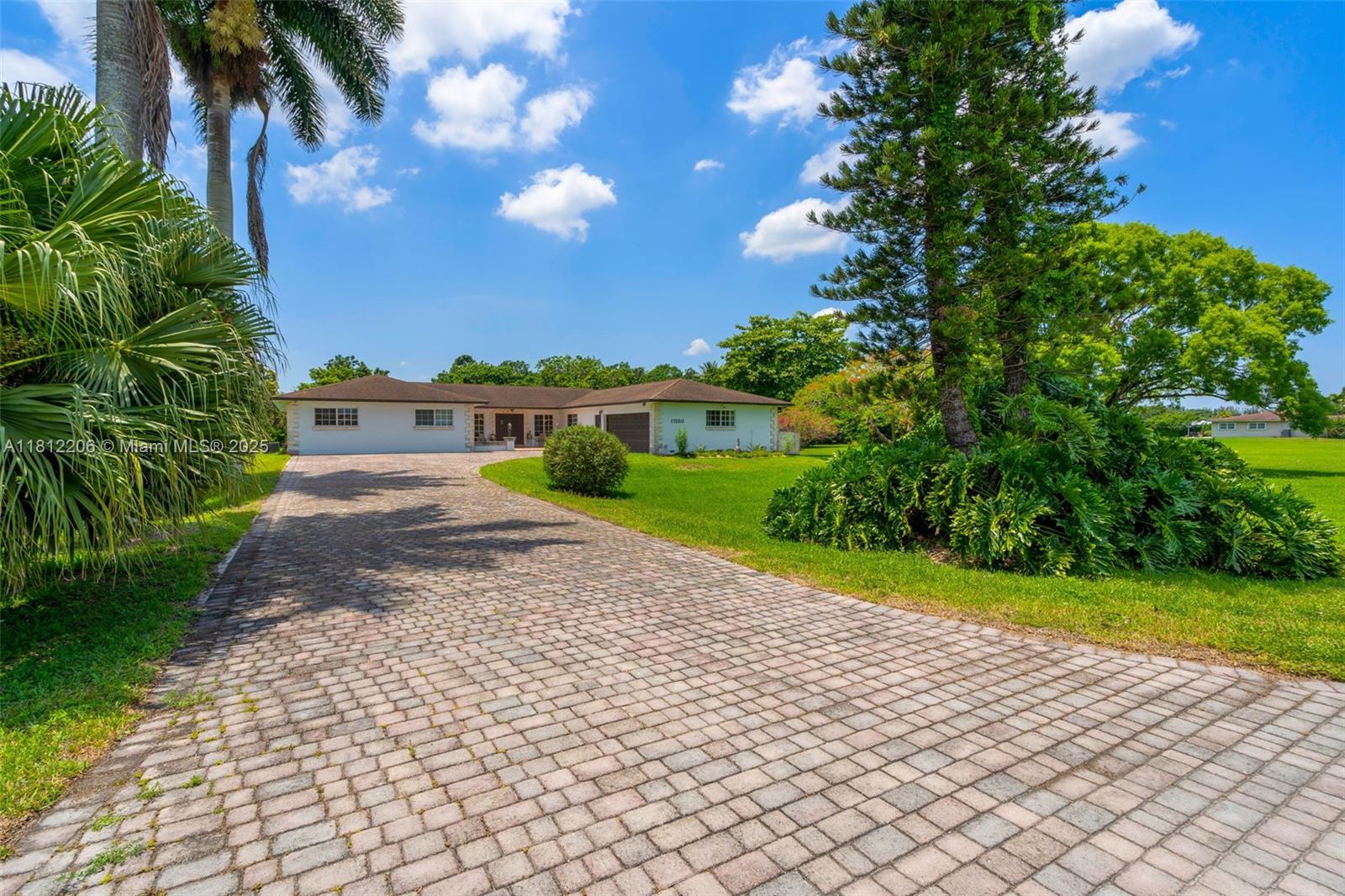 17550 Southwest 59th Court Southwest Ranches, FL 33331 - Photo 2 of 51 a view of an outdoor space and a yard