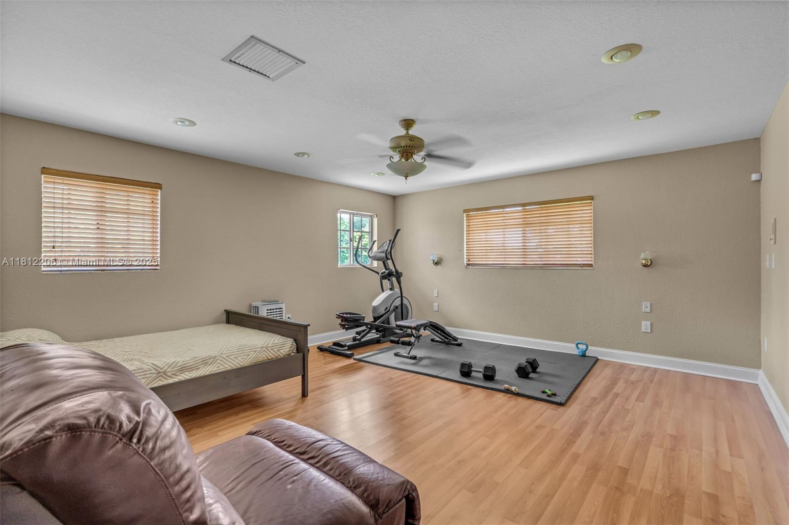 17550 Southwest 59th Court Southwest Ranches, FL 33331 - Photo 21 of 51 a bedroom with furniture and a window
