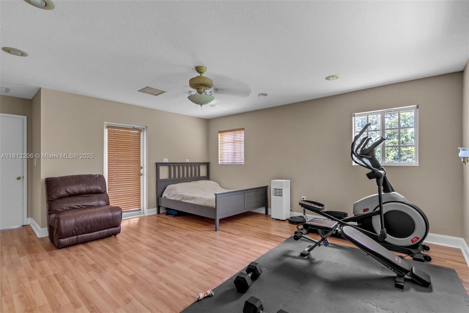 17550 Southwest 59th Court Southwest Ranches, FL 33331 - Photo 22 of 51 a living room with furniture and a wooden floor