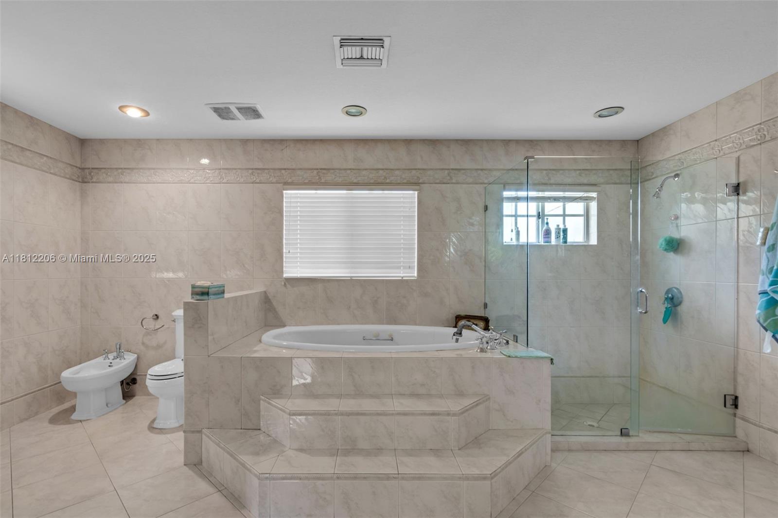 17550 Southwest 59th Court Southwest Ranches, FL 33331 - Photo 23 of 51 a bathroom with a bathtub and shower