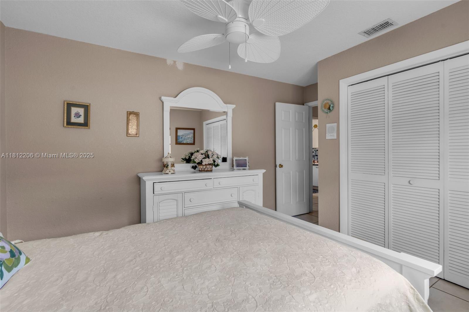 17550 Southwest 59th Court Southwest Ranches, FL 33331 - Photo 29 of 51 a bedroom with a bed and a dresser