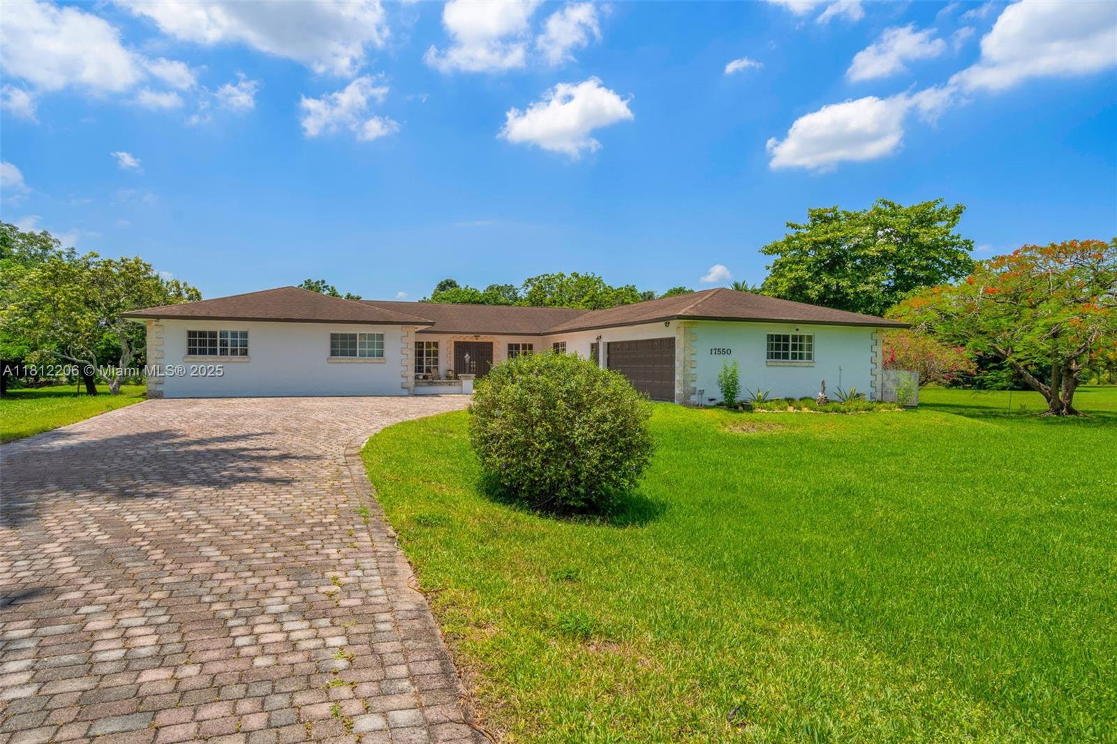 17550 Southwest 59th Court Southwest Ranches, FL 33331 - Photo 4 of 51 a view of house with a yard