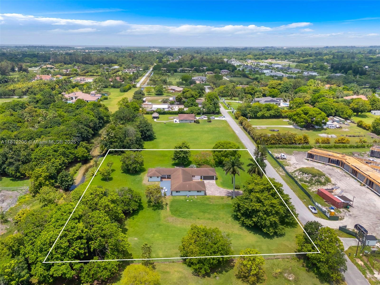 17550 Southwest 59th Court Southwest Ranches, FL 33331 - Photo 47 of 51 an aerial view of residential houses with outdoor space and river