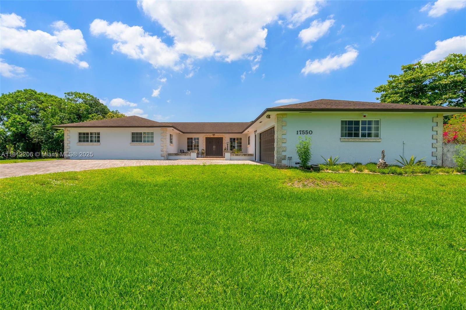 17550 Southwest 59th Court Southwest Ranches, FL 33331 - Photo 5 of 51 a view of a house with a yard