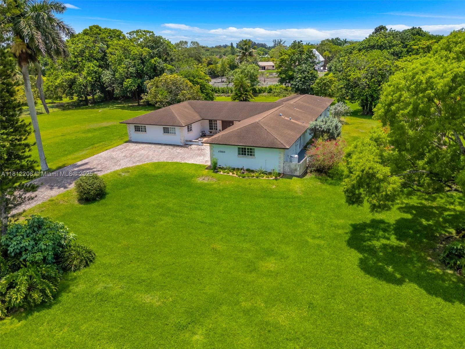 17550 Southwest 59th Court Southwest Ranches, FL 33331 - Photo 51 of 51 a view of a house with a big yard