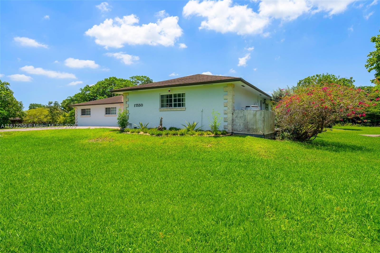 17550 Southwest 59th Court Southwest Ranches, FL 33331 - Photo 6 of 51 a yellow house with a big yard