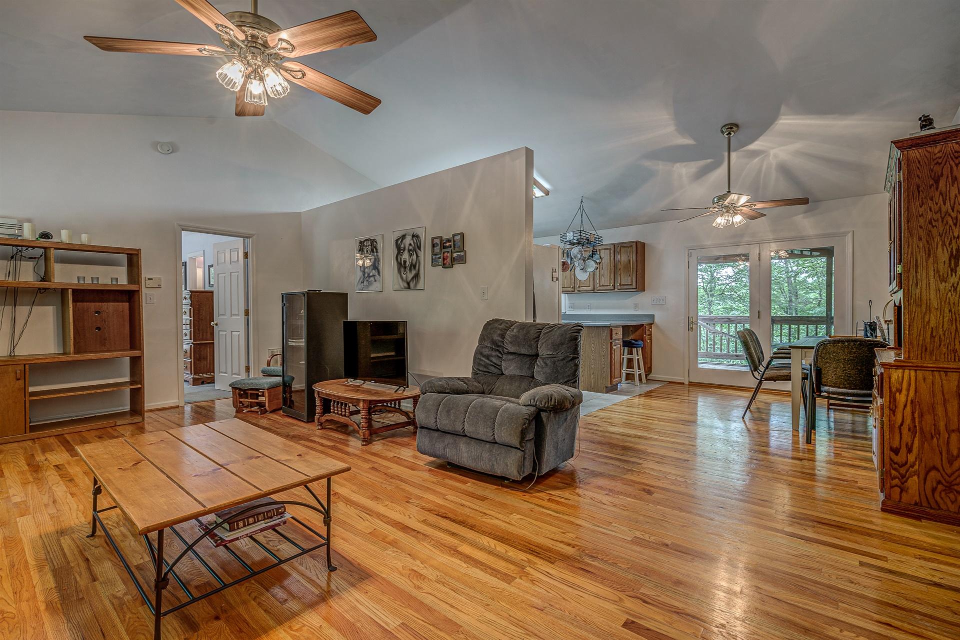 684 Northridge Road Hardy, VA 24101 - Photo 11 of 75 a living room with furniture a flat screen tv and a table