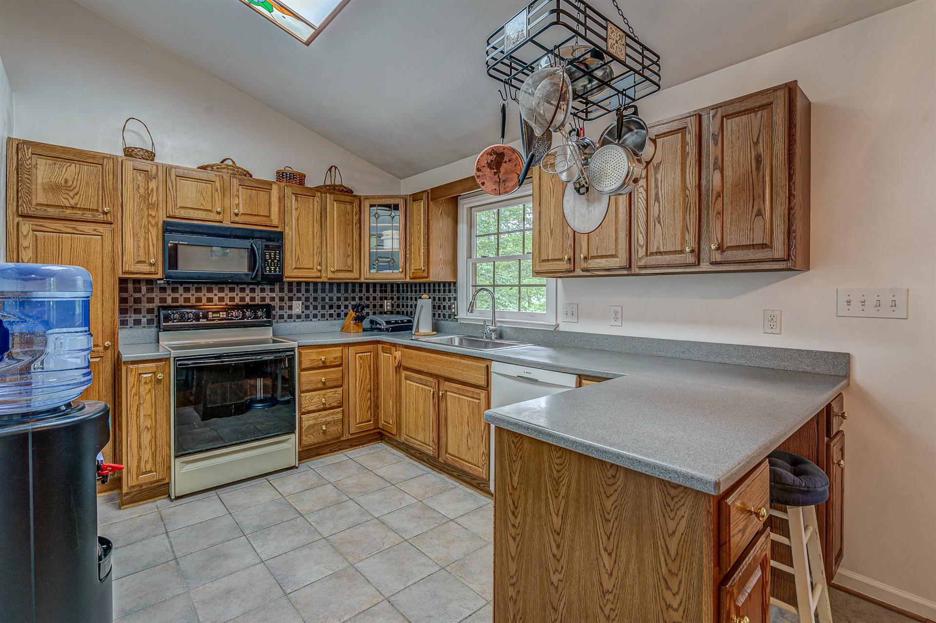 684 Northridge Road Hardy, VA 24101 - Photo 13 of 75 a kitchen with granite countertop a stove and a sink