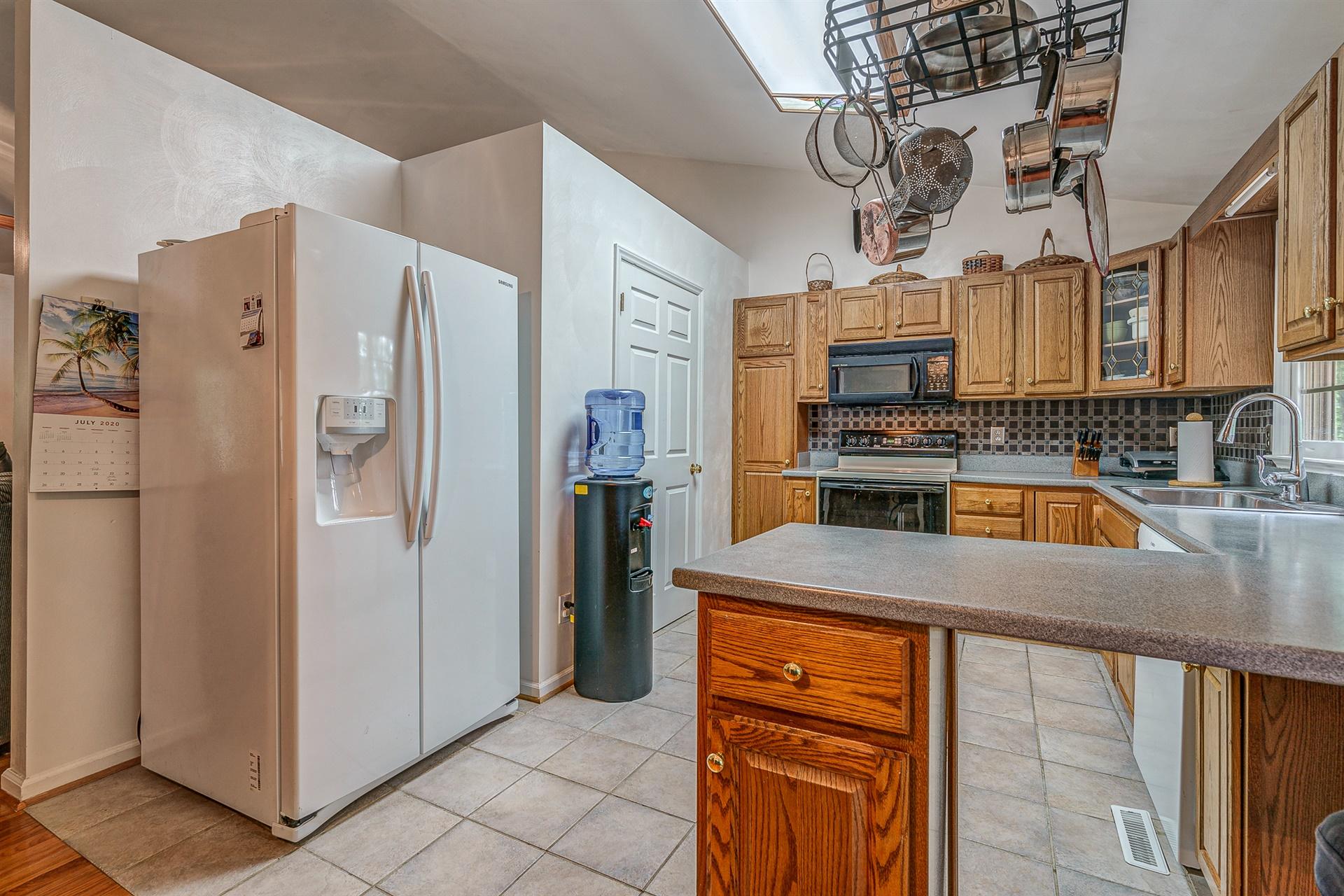 684 Northridge Road Hardy, VA 24101 - Photo 15 of 75 a kitchen with stainless steel appliances granite countertop a refrigerator a stove and a sink