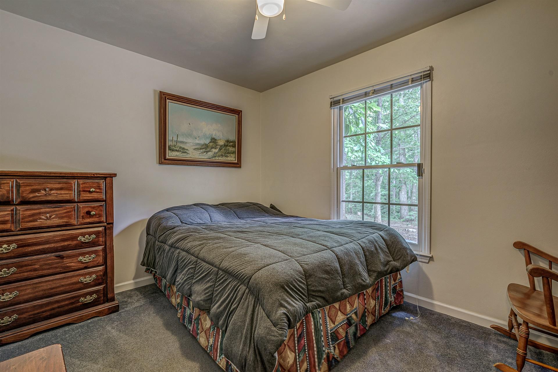 684 Northridge Road Hardy, VA 24101 - Photo 18 of 75 a bed sitting in a bedroom next to a window