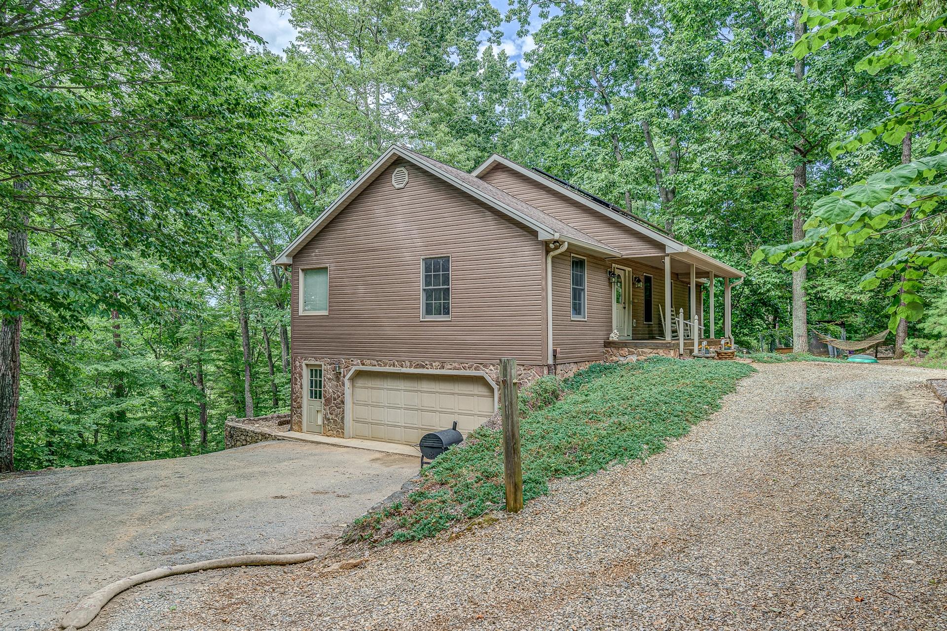 684 Northridge Road Hardy, VA 24101 - Photo 3 of 75 a front view of house with yard and trees all around