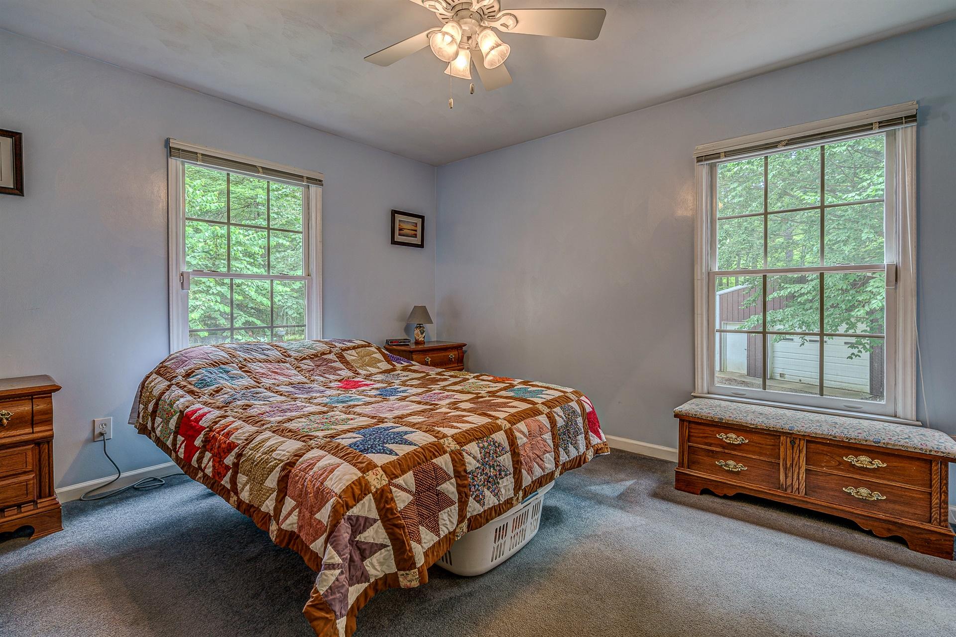 684 Northridge Road Hardy, VA 24101 - Photo 21 of 75 a bedroom with a bed and a window