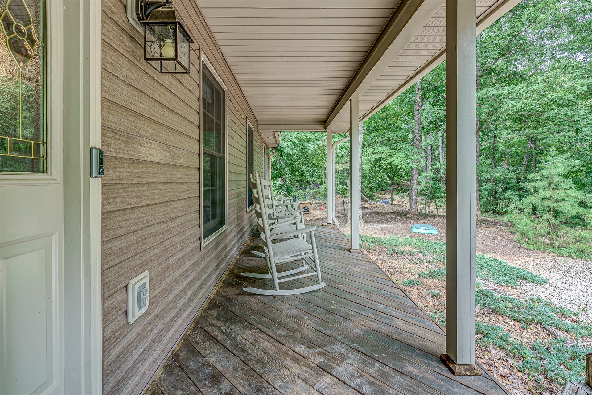 684 Northridge Road Hardy, VA 24101 - Photo 6 of 75 a view of a deck with a table and chairs next to a yard