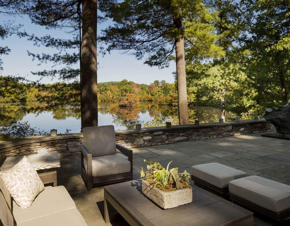 360-356 Great Meadows Road Concord, MA 01742 - Photo 3 of 22 a view of a patio with couches table and chairs with wooden fence