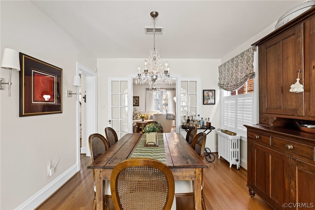 428 Roseneath Road Richmond, VA 23221 - Photo 12 of 40 a view of a dining room with furniture window and wooden floor