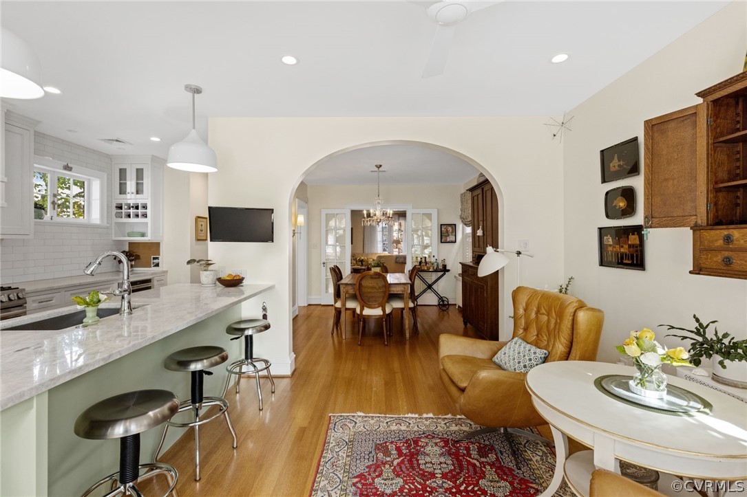 428 Roseneath Road Richmond, VA 23221 - Photo 15 of 40 a living room with furniture and a chandelier