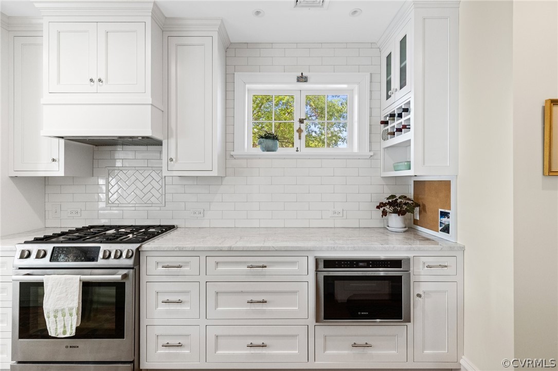 428 Roseneath Road Richmond, VA 23221 - Photo 21 of 40 a kitchen with granite countertop white cabinets and appliances