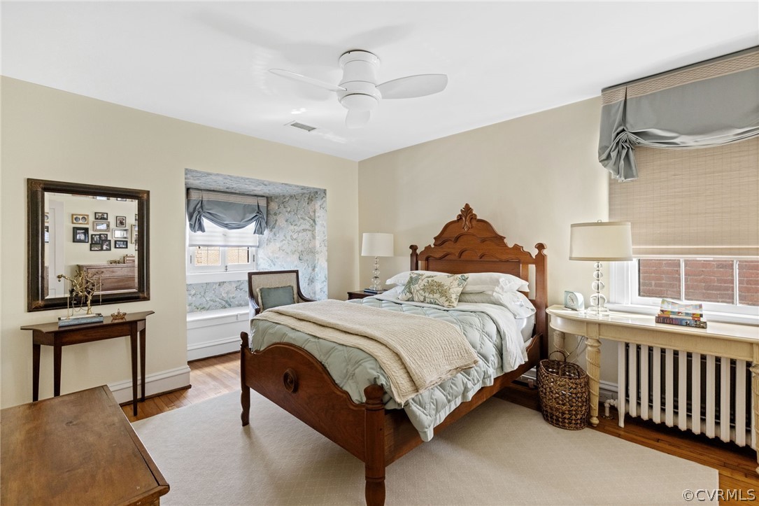 428 Roseneath Road Richmond, VA 23221 - Photo 29 of 40 a bedroom with a bed and a chandelier