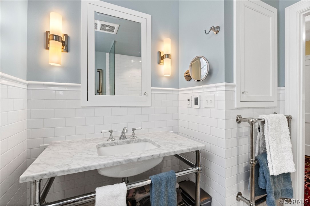 428 Roseneath Road Richmond, VA 23221 - Photo 33 of 40 a bathroom with a granite countertop sink and a mirror