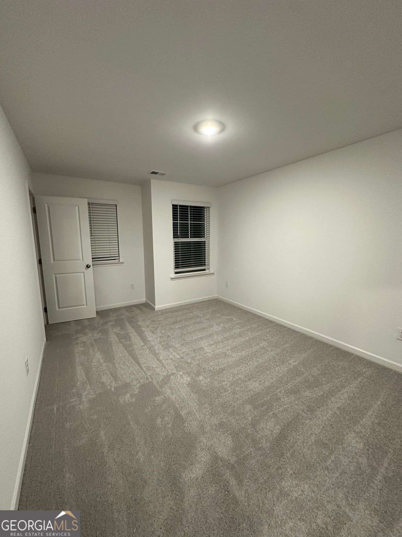 4281 Marsha Street Doraville, GA 30360 - Photo 14 of 38 a view of an empty room with a window