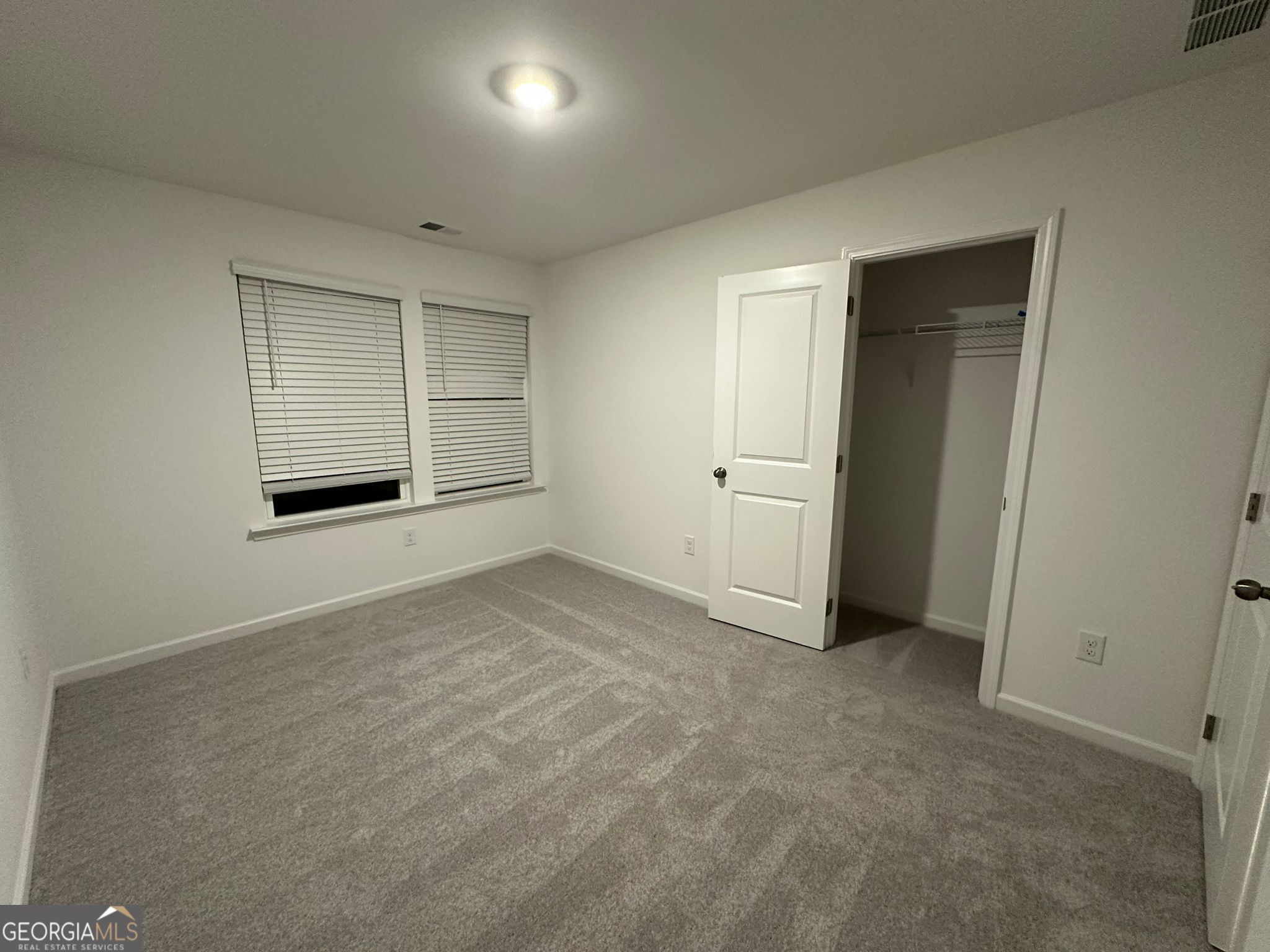 4281 Marsha Street Doraville, GA 30360 - Photo 15 of 38 an empty room with a empty space and windows