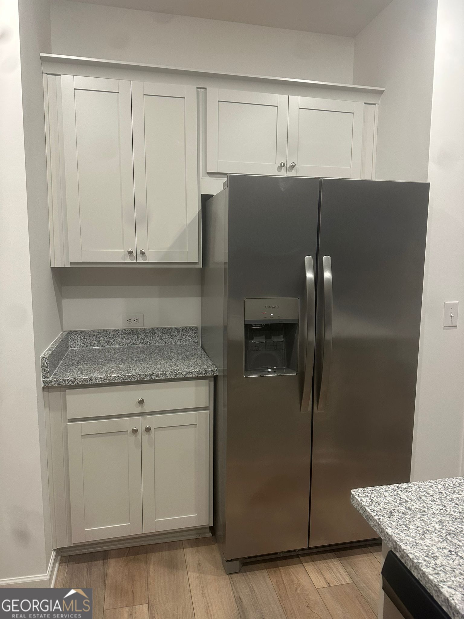 4281 Marsha Street Doraville, GA 30360 - Photo 21 of 38 a kitchen with a refrigerator and cabinets