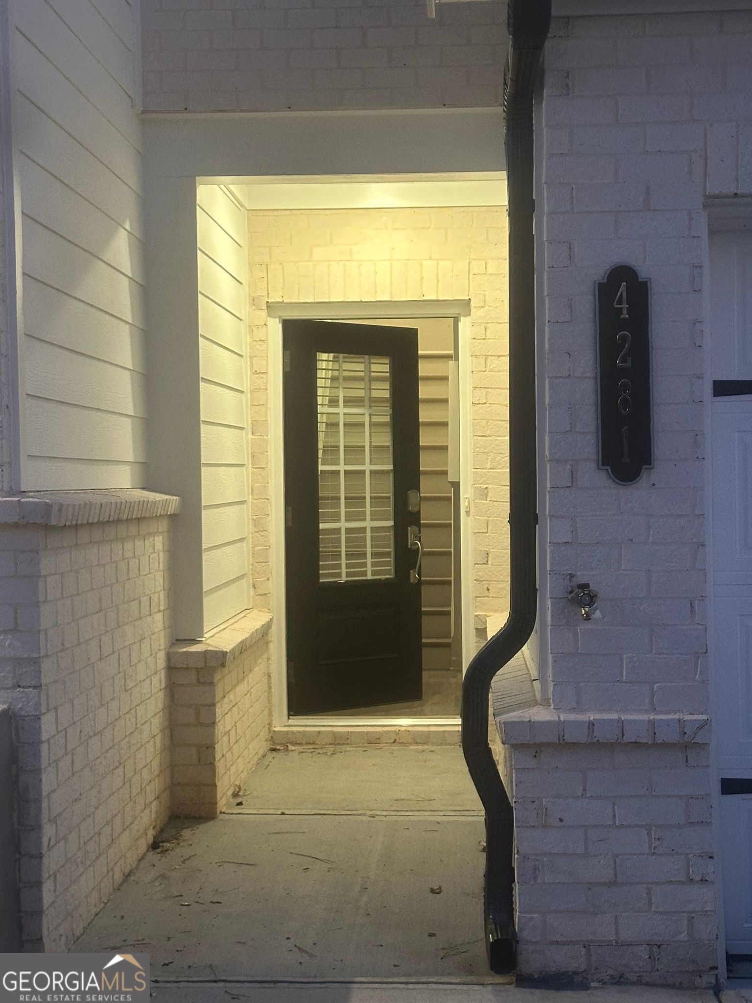 4281 Marsha Street Doraville, GA 30360 - Photo 24 of 38 a front view of a house with a glass door