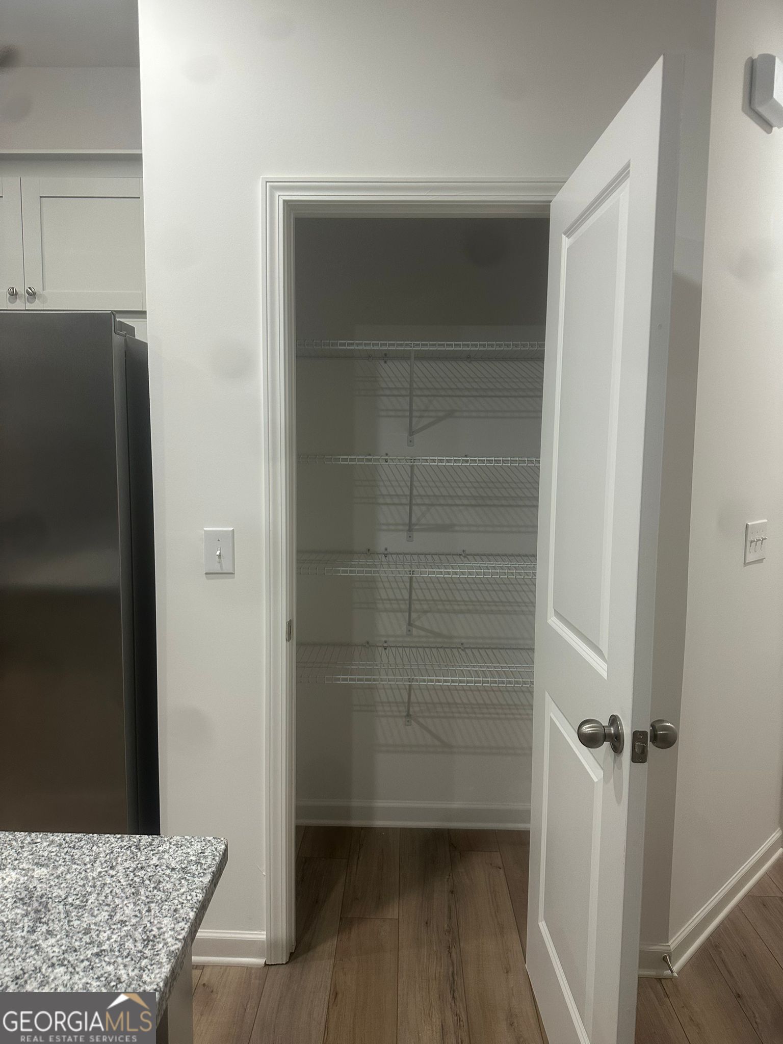 4281 Marsha Street Doraville, GA 30360 - Photo 29 of 38 a view of walk in closet with empty racks